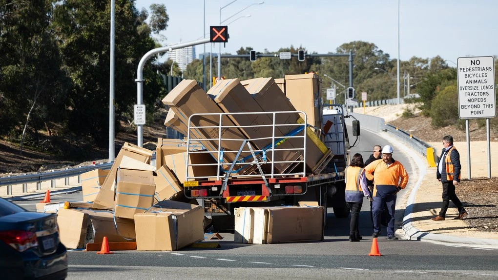 breakingFridges fall off back of truck, block entry to major freeway