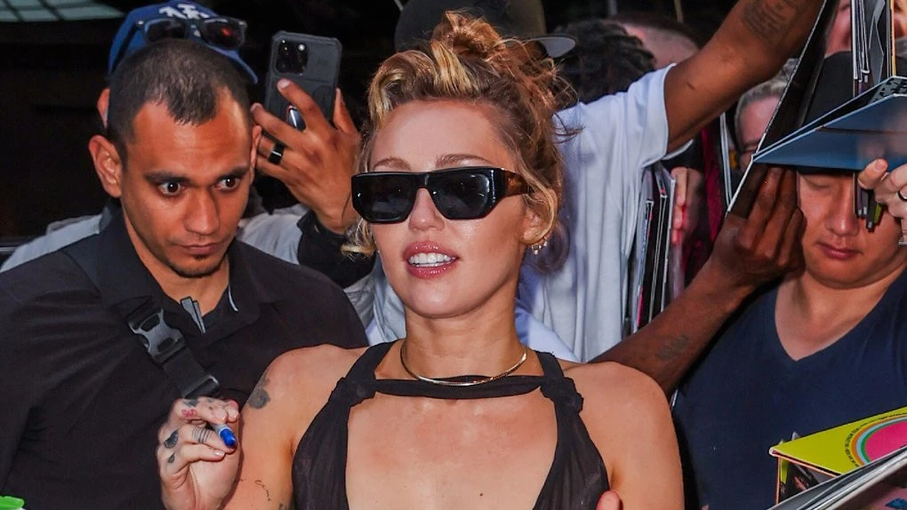 Miley Cyrus goes braless in completely sheer dress