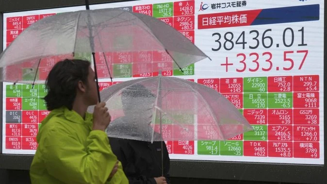 Asian shares higher, dollar flat before Europe outlook