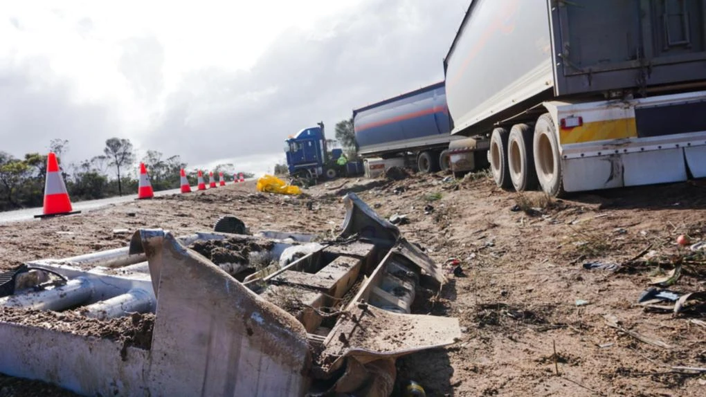 Two dead after car towing caravan collides with truck