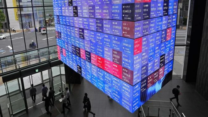 World stocks slide as Trump's Fed attacks jangle nerves