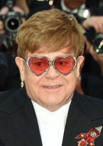 Sir Elton John remains 'optimistic' amid health struggles