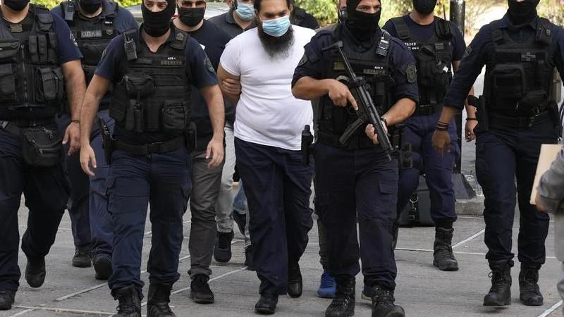 Greek priest charged over acid attack