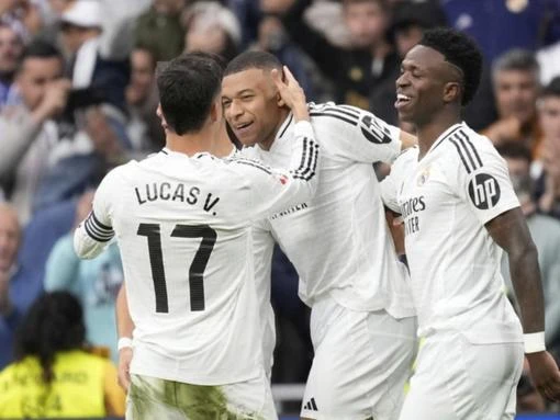 Mbappe double helps Madrid keep pace with Barcelona