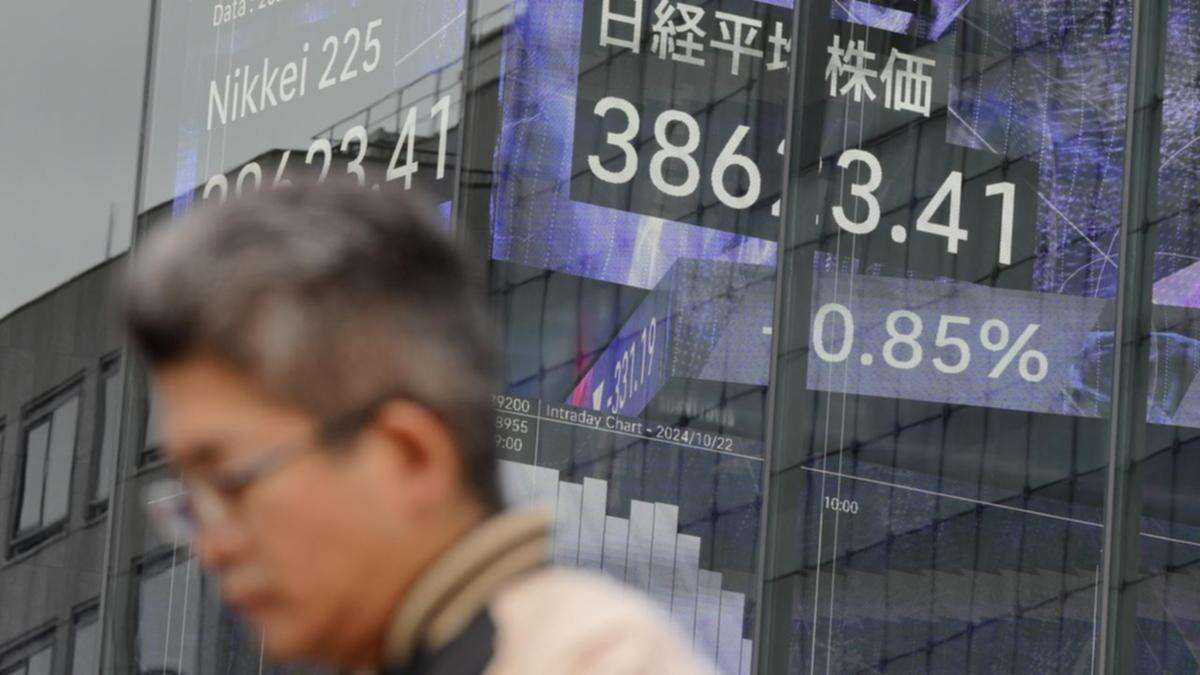 Asian stocks mixed, dollar drifts ahead of US jobs data