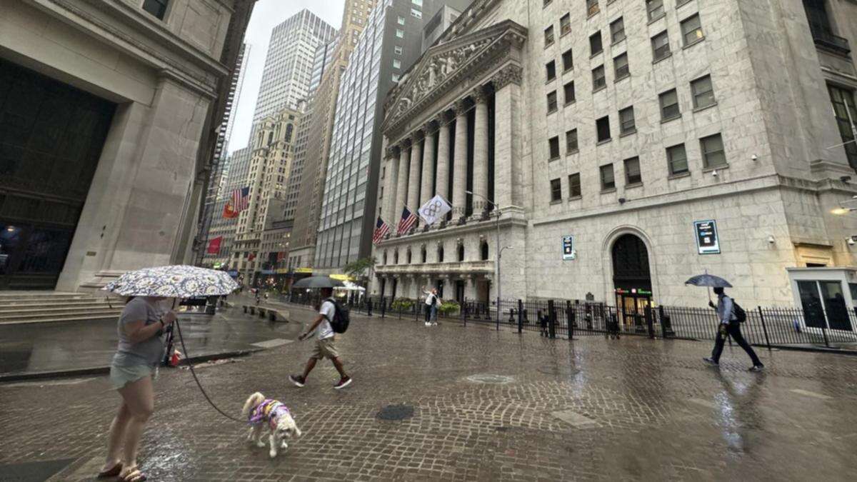 Wall St edges lower as volatile week draws to a close