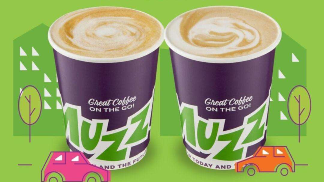 Muzz Buzz pouring FREE coffee to warm up your winter morning