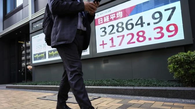 Stocks slide in Asia, recession fears pummel sentiment