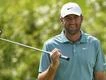 Scheffler moves to the top as PGA resumes after rain
