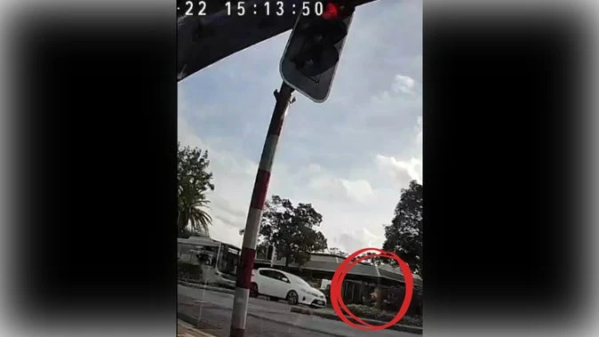 Perth Now exclusiveWATCH: Two kids in scary near-miss as driver runs red light