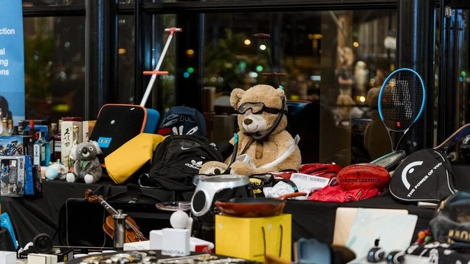Airport's lost lots auctioned off to teach kids to swim