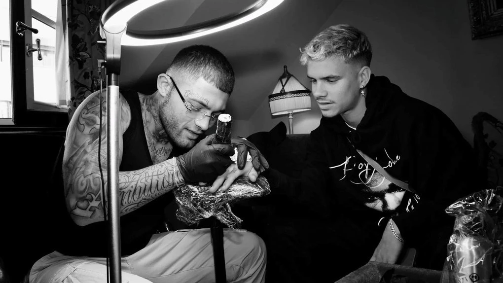 Celebrity tattoo artist Certified Letter Boy partners with Dave's Hot Chicken for opening of new Soho studio