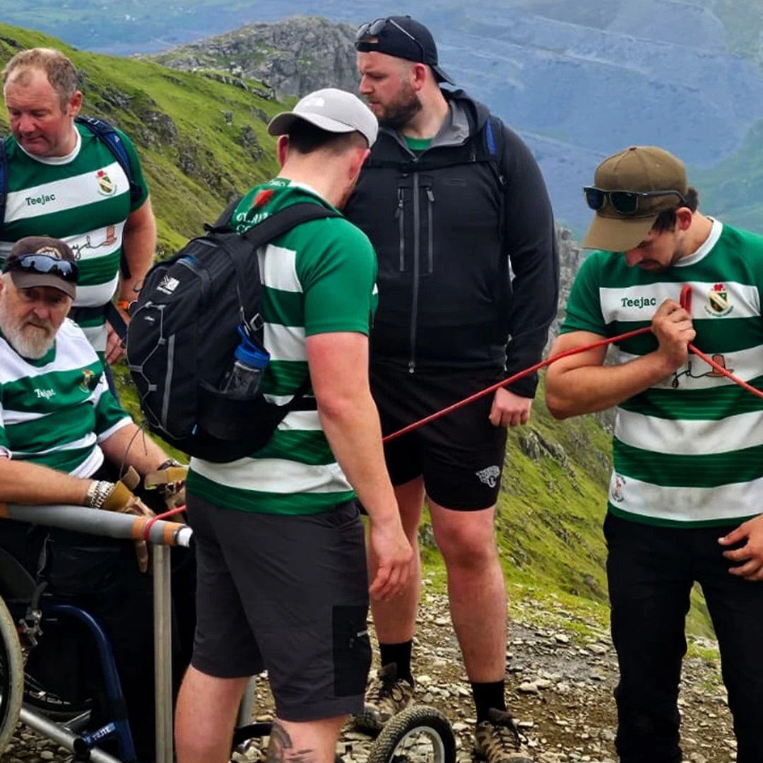 WATCH | Why this Wales rugby team carried a friend in a wheelchair up a mountain