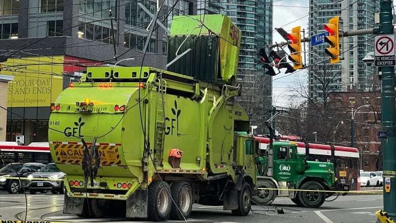 King-Spadina intersection will likely be closed until end of week after garbage truck damages streetcar wires