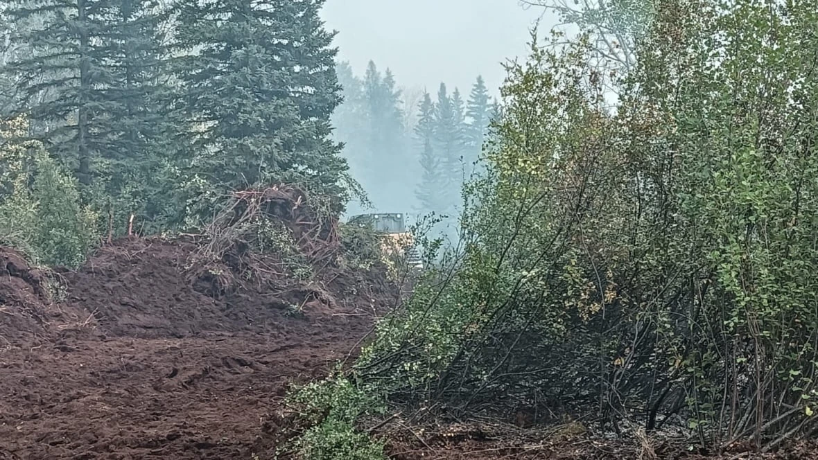 Crews battling Fort Providence wildfire gearing up for challenging conditions, officials say