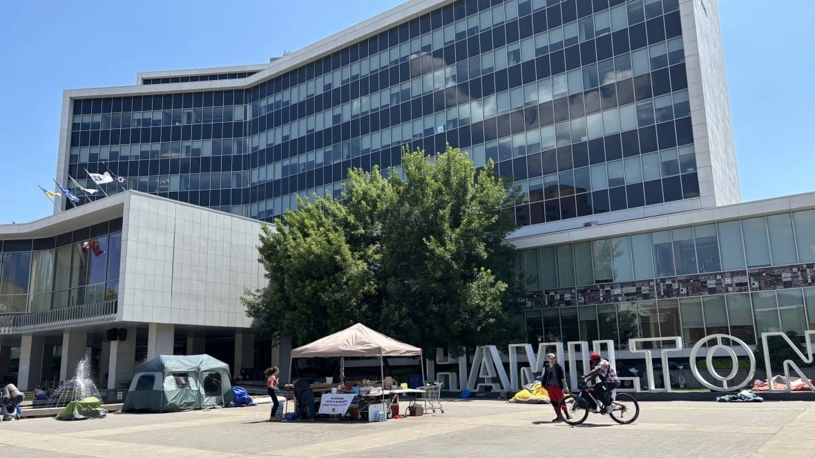 City Hall encampment protesters forced to move from shaded park to concrete amid heat wave