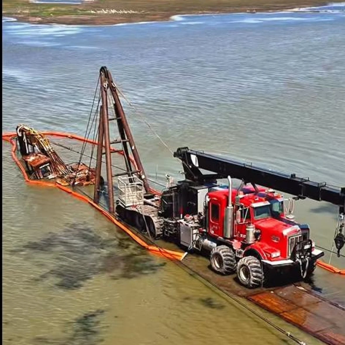 Excavator that fell through ice years ago — and became a landmark — finally pulled out of Sask. lake