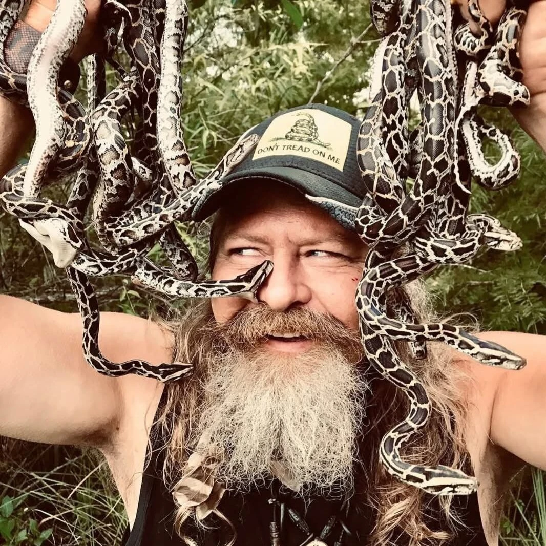 A dead python will get you a free pizza at this man's restaurant. Yes, it's in Florida