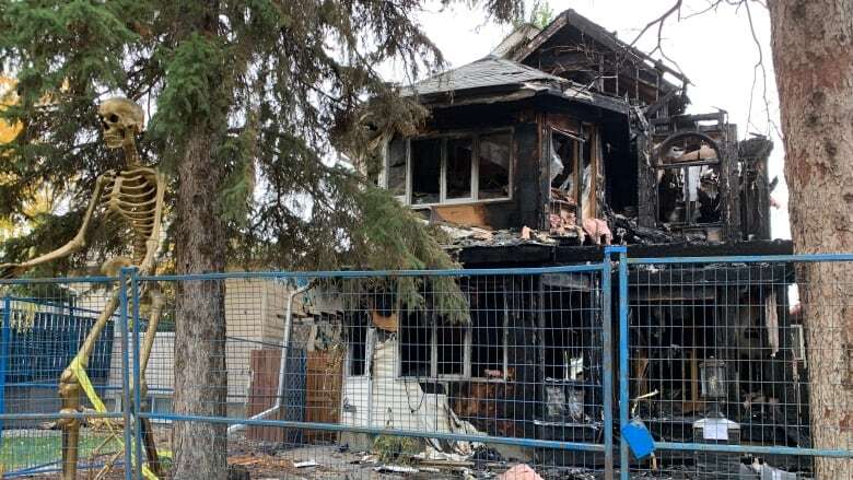 Edmonton neighbourhood on edge over notes asking for payment after house fire