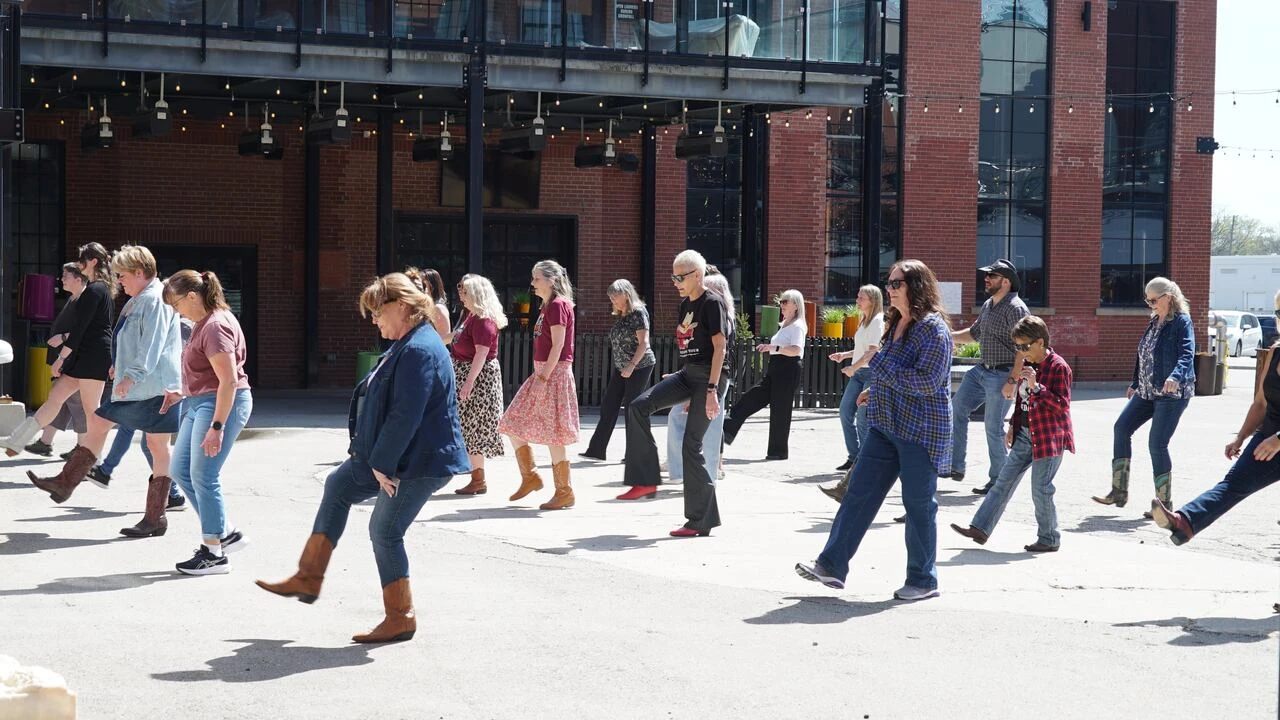 Line dancers worldwide are staging flash mobs. Is your city in for boot scooting?