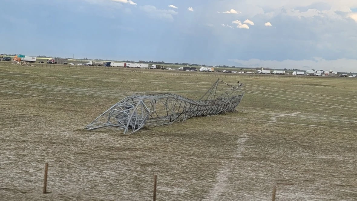 Severe thunderstorm in southern Alberta downs power lines, damages cars