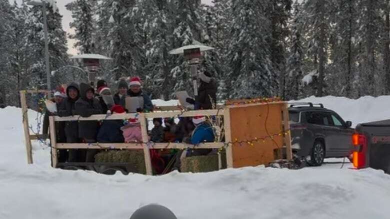 Watson Lake, Yukon, residents take to the streets to sing holiday classics