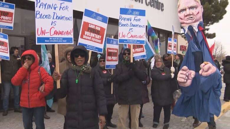 Dozens rally against paid plasma donation clinic in Whitby, Ont., calling practice unethical