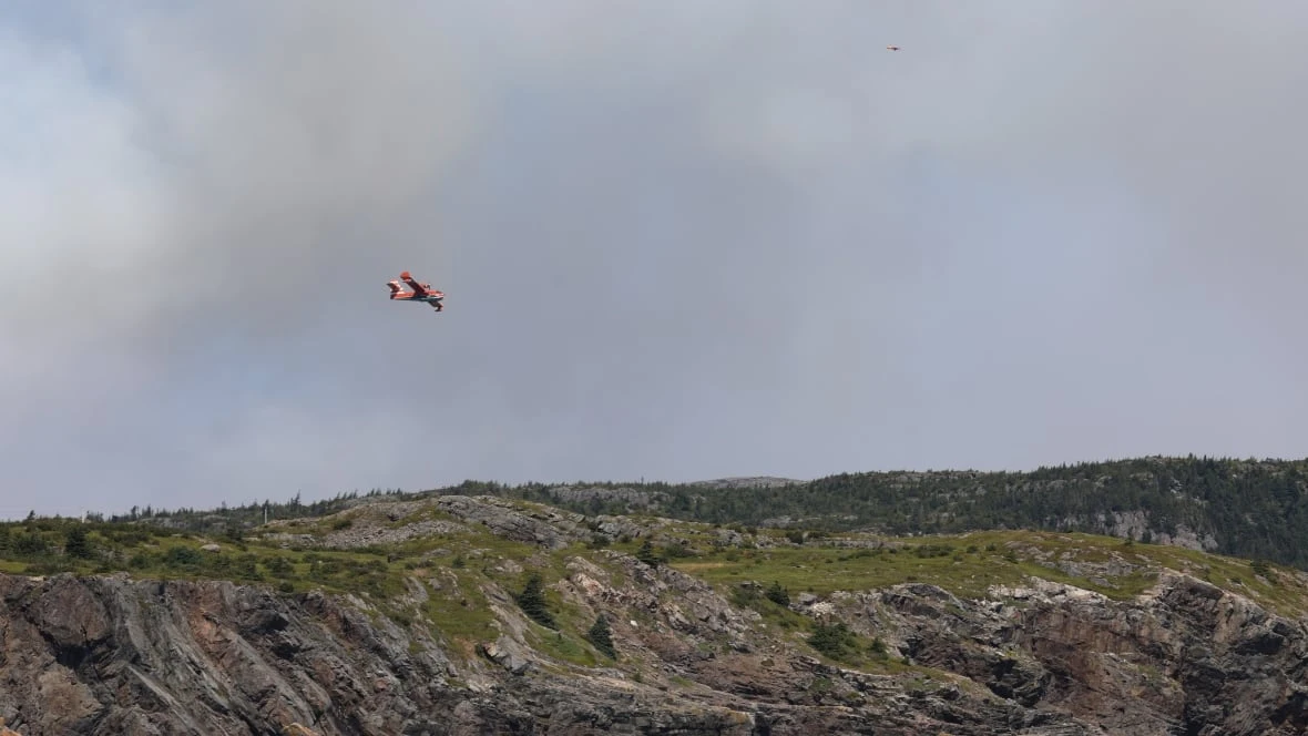 Bulldozer, excavator on site of Kingston fire to build fire guard, says fire duty officer