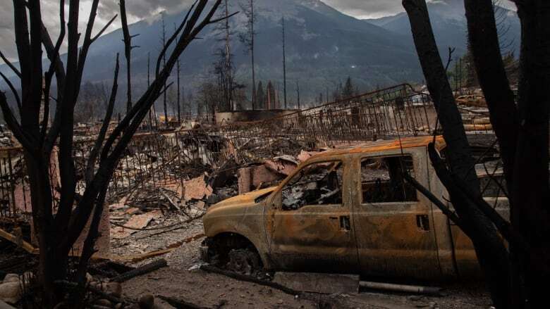 Jasper residents survey the damage as tours of wildfire-ravaged neighourhoods continue