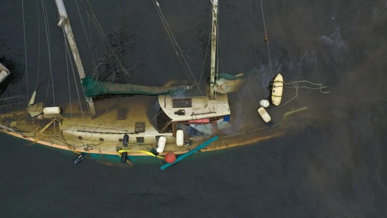 Sunken sailboat near Browns Flat towed closer to shore, says coast guard