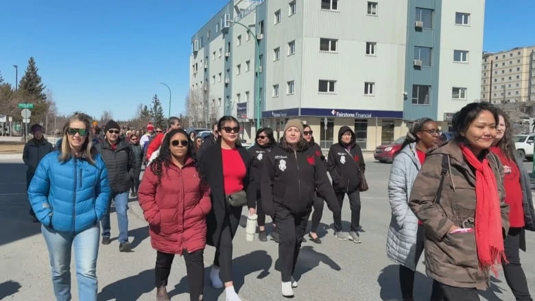 'Don't give up on yourself or your family': Yellowknife marks Red Dress Day with march for MMIWG2S+