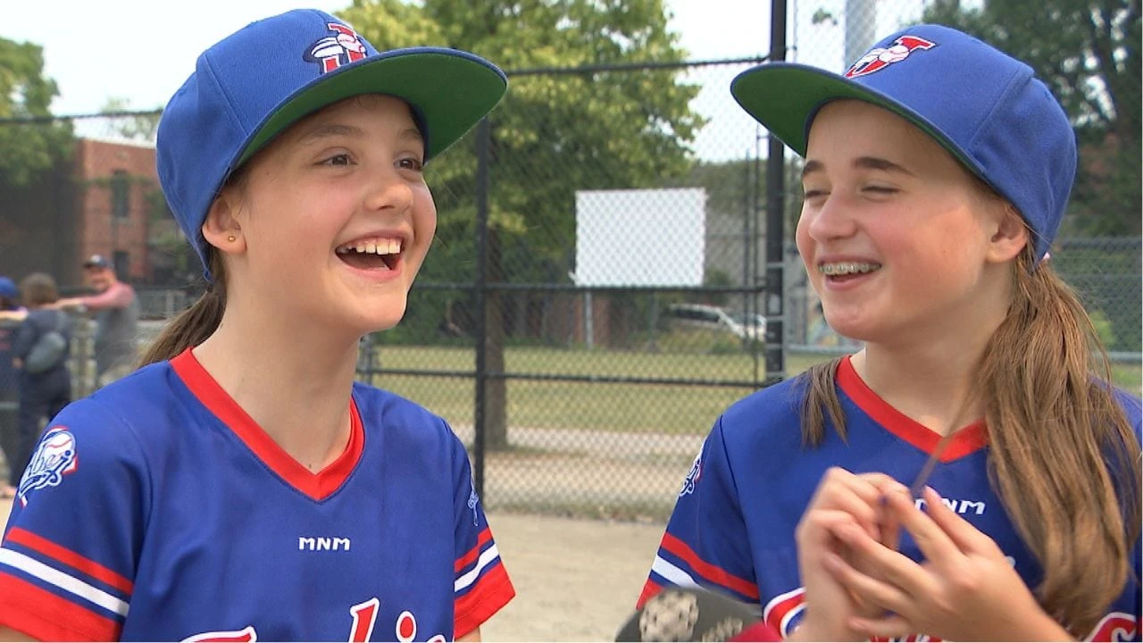 Girls play baseball at this Montreal park. The city wants to turn it into a library