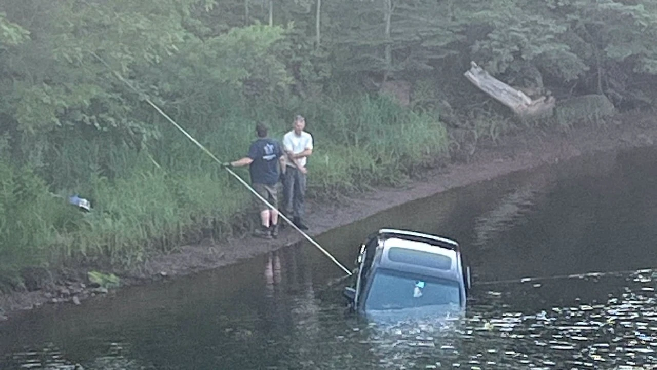 Car parked by paddleboarders rolls into river, sparking unusual retrieval operation