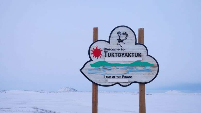 Visiting veterinarians in Tuktoyaktuk, N.W.T., taking a census of dogs