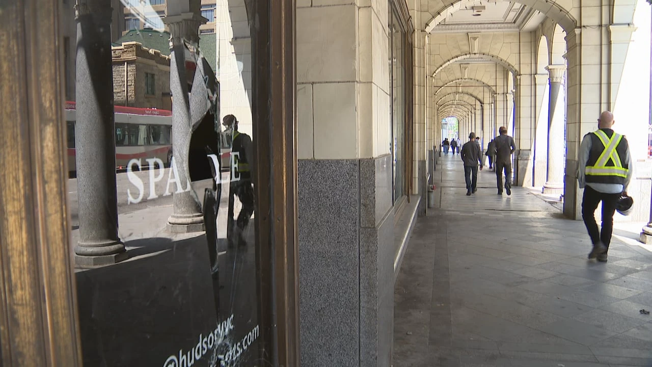 Cracked tiles and broken glass. Former downtown Calgary Hudson's Bay building showing signs of disrepair