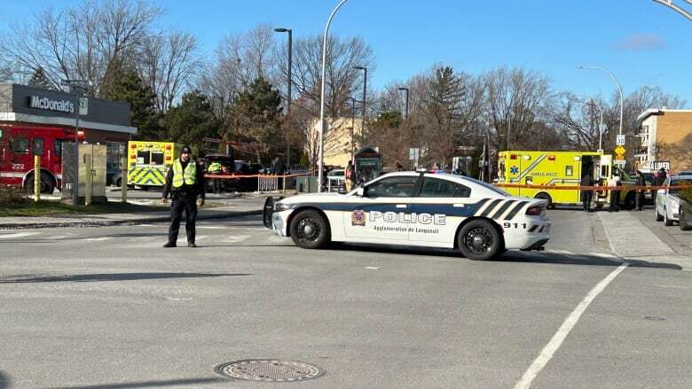 Bystanders rescue injured people caught beneath car after it struck a bus shelter in Longueuil, Que.