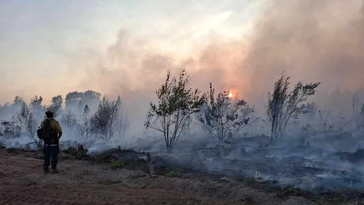 Out-of-control wildfires burn on, with slight relief from heat expected Thursday