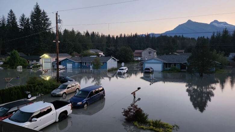 Residents in Alaska capital clean up swamped homes after an ice dam burst and unleashed a flood