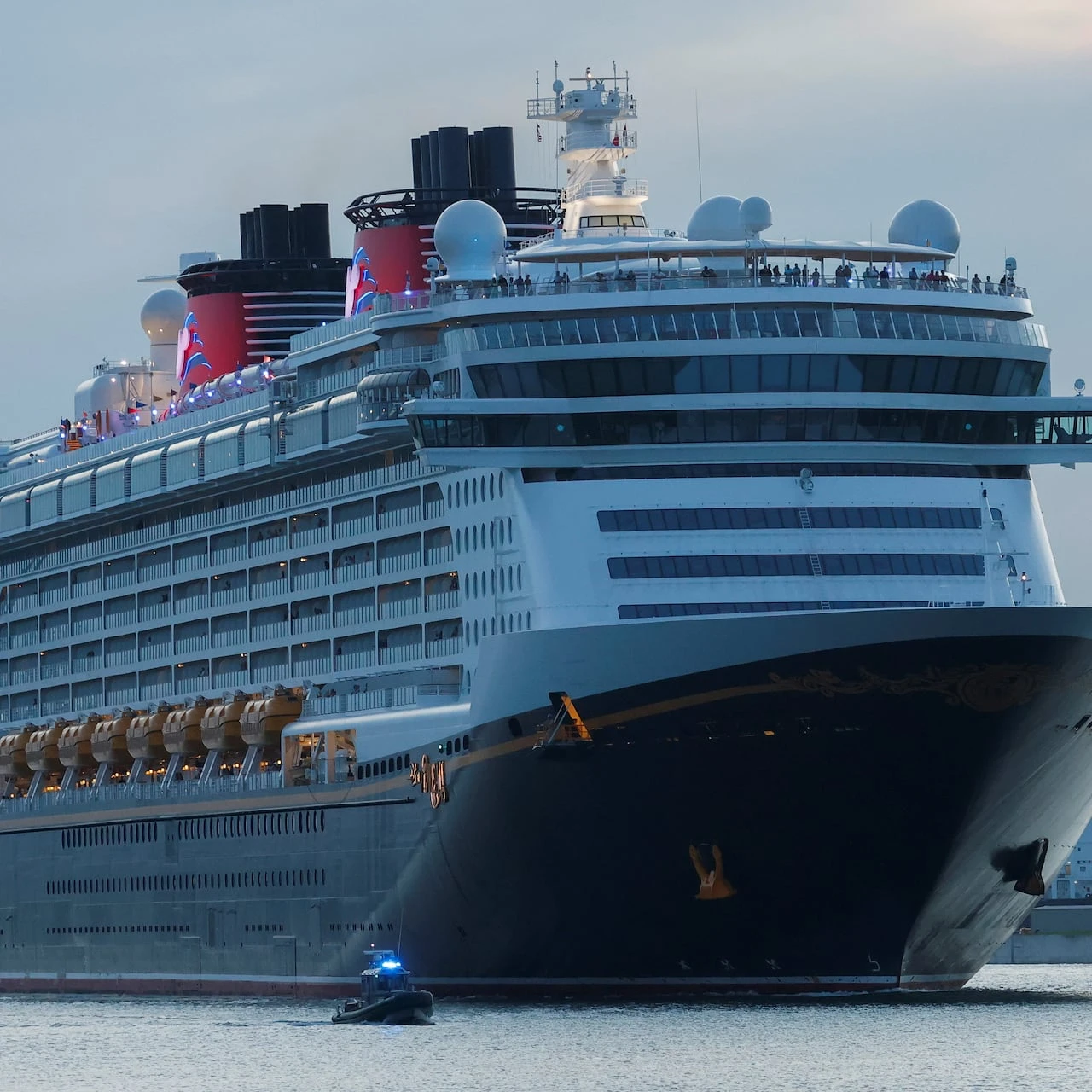 Child fell off Disney cruise ship after mom told her to pose for photo on railing, police say