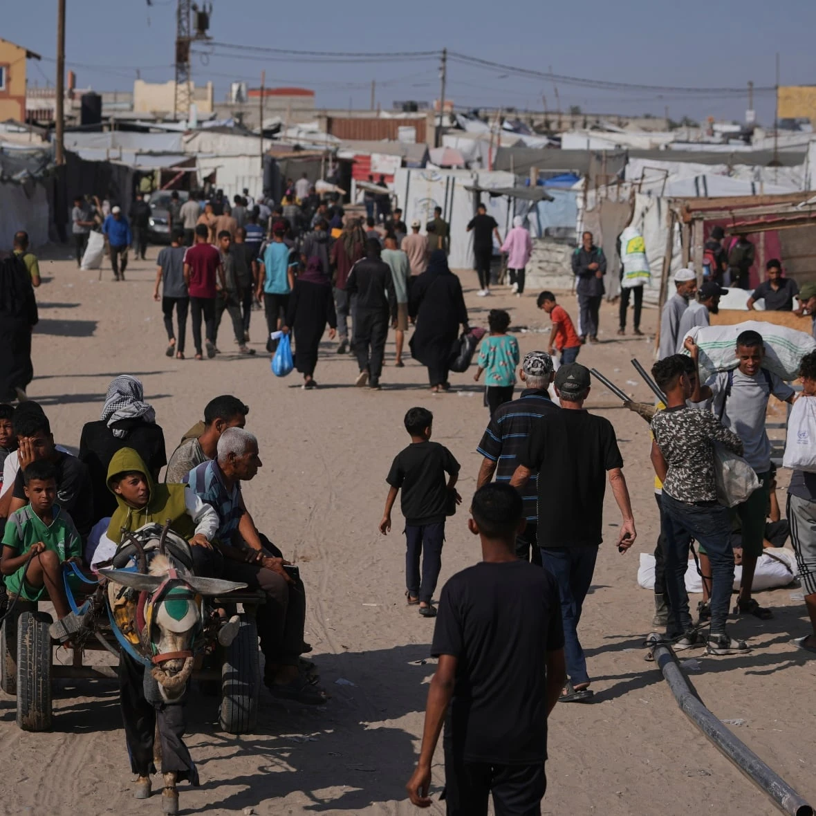 Palestinians say 5 killed by Israeli fire near aid sites. Israel says it fired warning shots