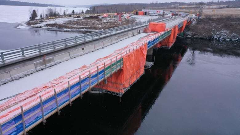 Traffic delays will continue for months at Mactaquac Dam, near Fredericton