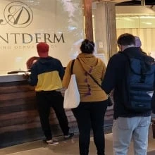 Wait times for dermatology appointments have patients lining up before dawn at this walk-in clinic