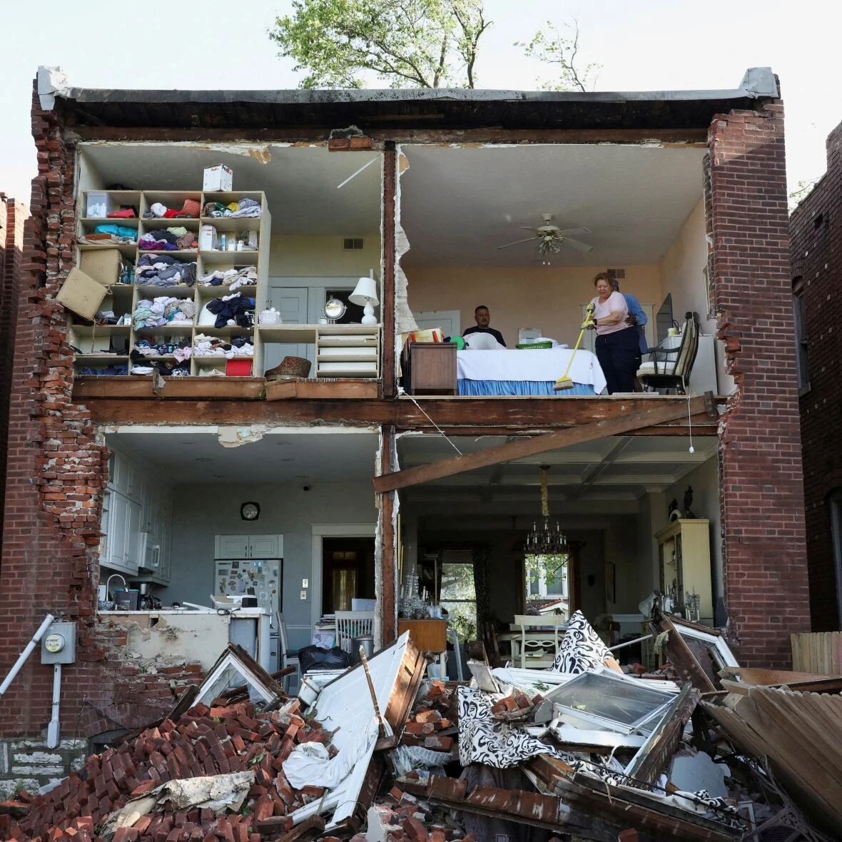 Severe storms sweep through Kentucky, killing at least 14 people, after tornado batters Missouri