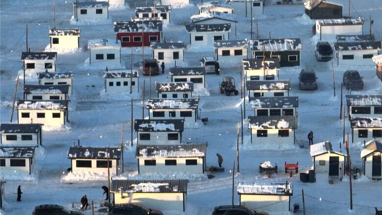 Quebec ice fishing aficionados celebrating colder winter