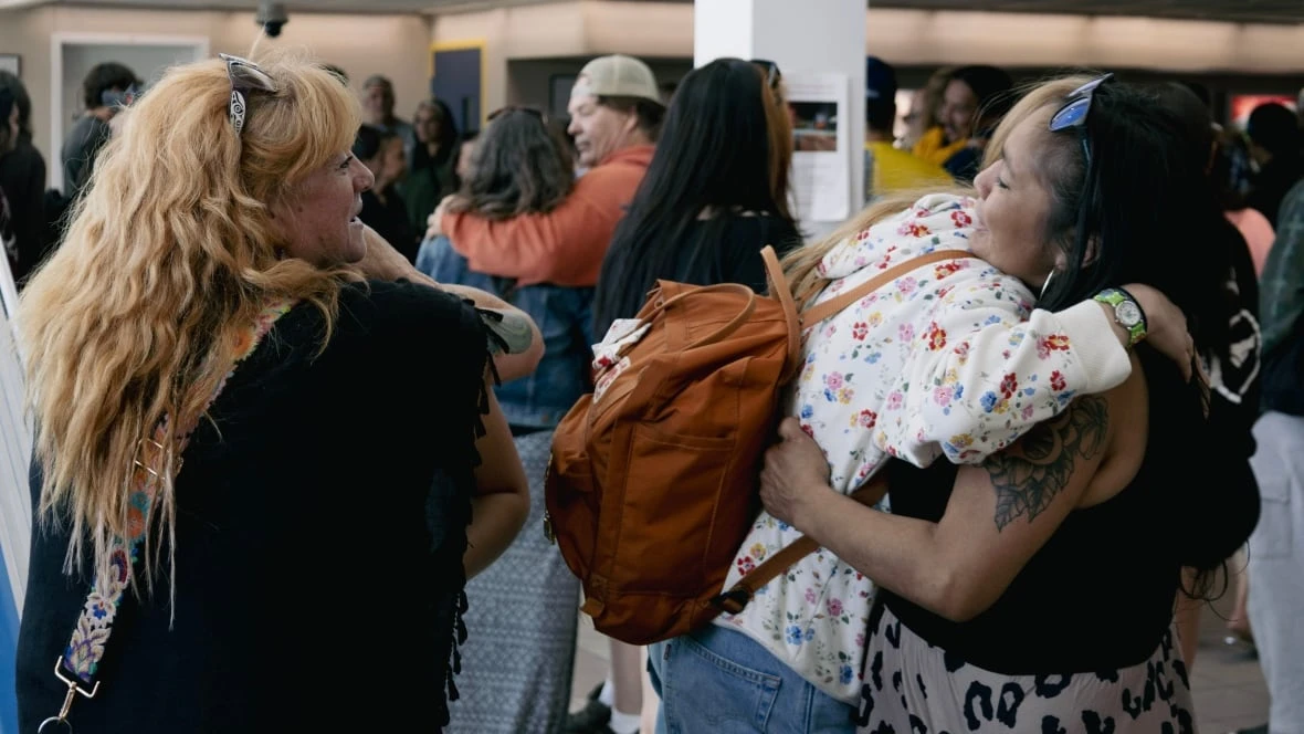 Hugs in the airport as Tłegǫ́hłı̨ Got'įnę members arrive in Norman Wells, N.W.T. to celebrate self-government