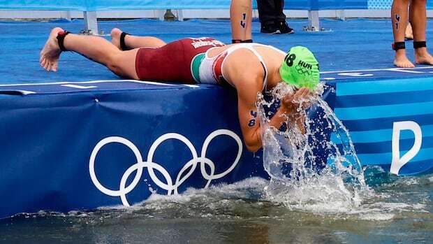 Olympic triathletes dive into the Seine as water finally deemed safe