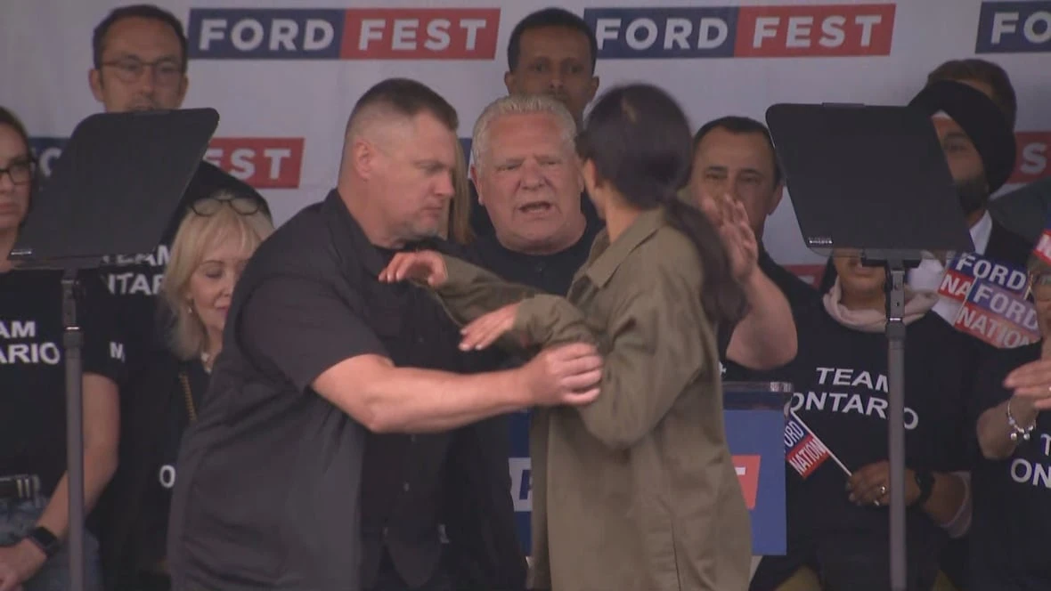 Protester gets on Ford Fest stage in Etobicoke at annual Ontario PC event