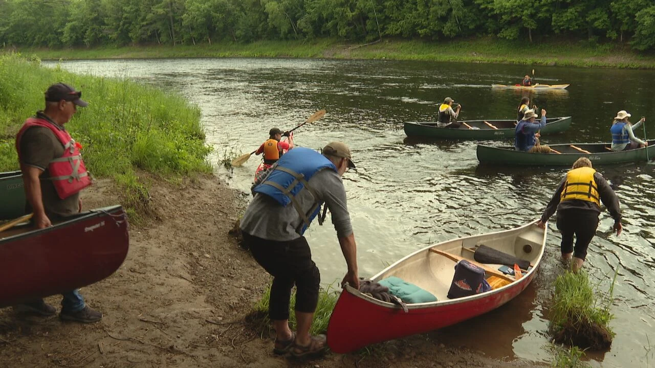 Over 100 people paddle to protest Sisson Mine