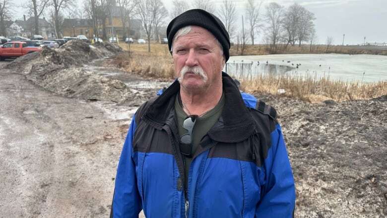 Snow bank and debris a 'pile of pollution' at Governor's Pond, walkers say