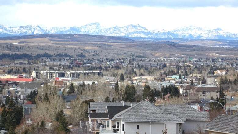 This Alberta town has mountains on one side, Calgary on the other — and some big growing pains